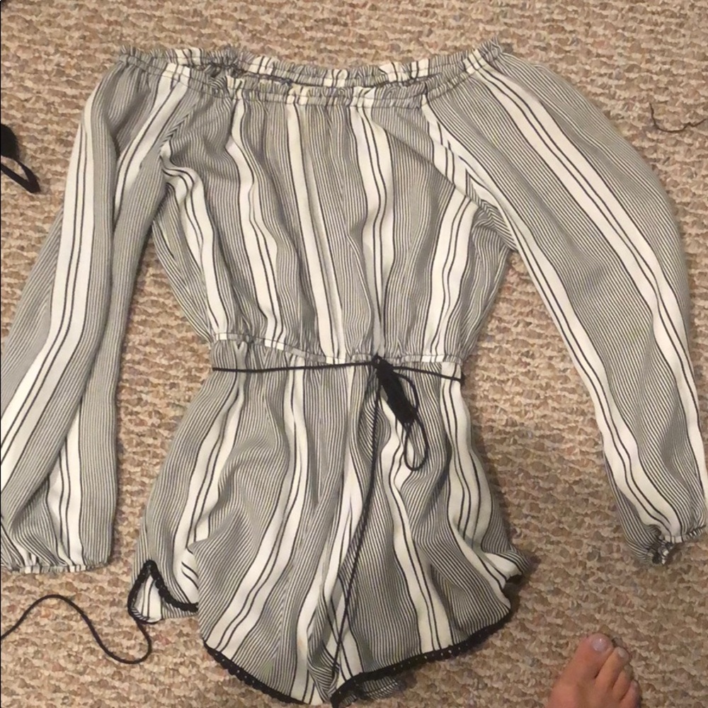 Black and white striped romper with tie.
